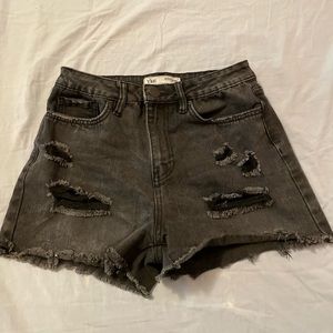 black ripped jean shorts